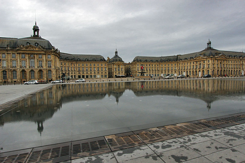 Place de la Bourse Reflects in Water Mirror on the Shores of the Garonne River in Bordeaux, France