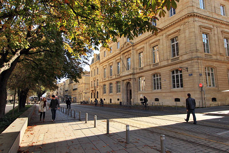 Sunny Fall Afternoon in Bordeaux, France Brings Walkers Out for the Day