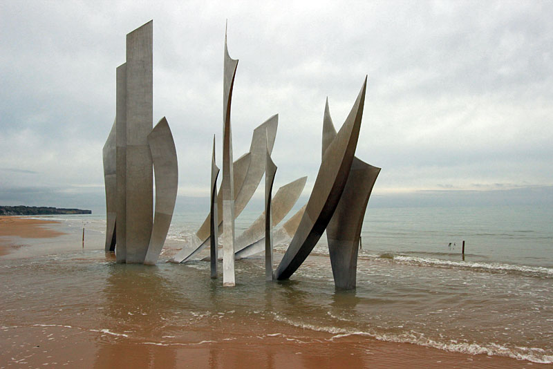 Ocean Washes Over Les Braves WWII Memorial on Omaha Beach in Normandy, France