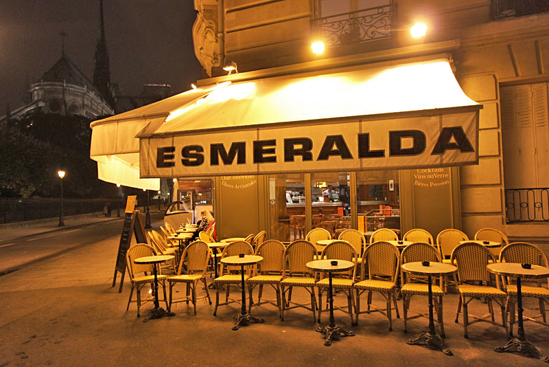 In Paris, People Sit in Chairs Facing the Street and Sip Espresso