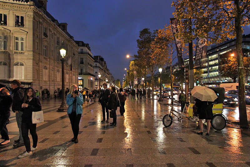 Rain-slicked Sidewalks Along the Champs Elysee in Paris, France