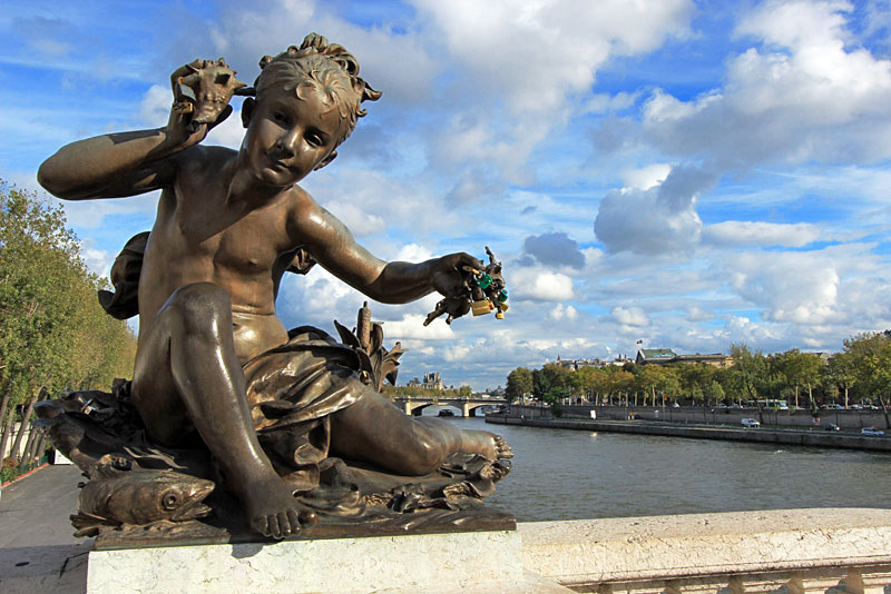 Love Padlocks Secured to Hand of Sculpture on Alexandre III Bridge in Paris