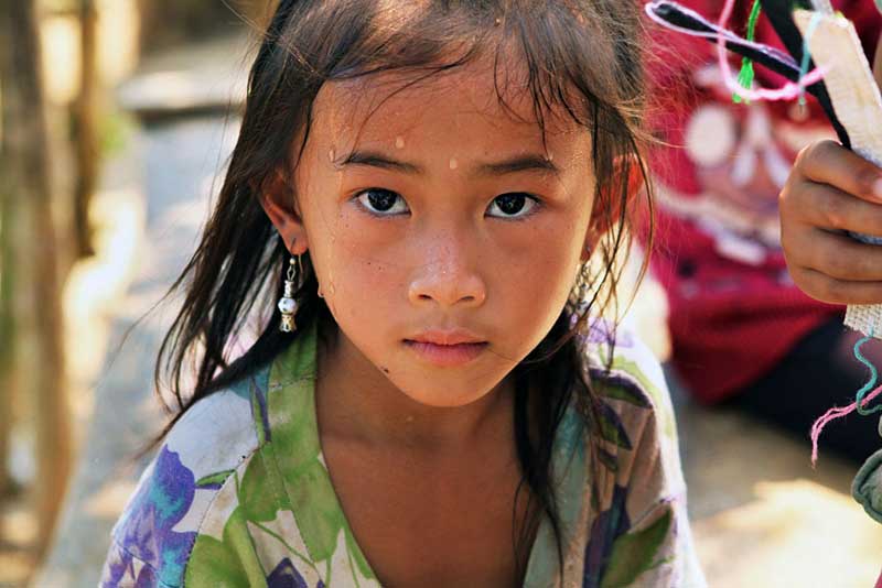 Hill Tribe Girl in a Tiny Village on the Shores of the Mekong River, Laos Runs to Meet Our Boat, Despite the Searing Summer Heat