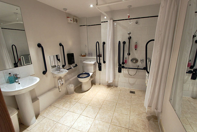Handicap toilet in Bedroom at Winford Manor Hotel room set up for guests with disabilities