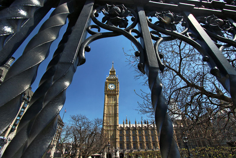 Big Ben Clock Tower, Seen Through the Wrought Iron Fence of Westminster Palace in London