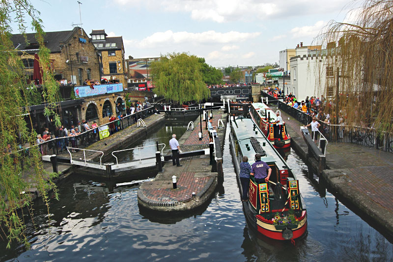 Longboats Negotiate a Series of Three Locks on Canals in Camden, London