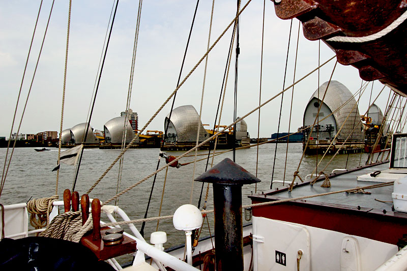 A Tall Ship Out of London's Greenwich Sails Through the Thames Barrier
