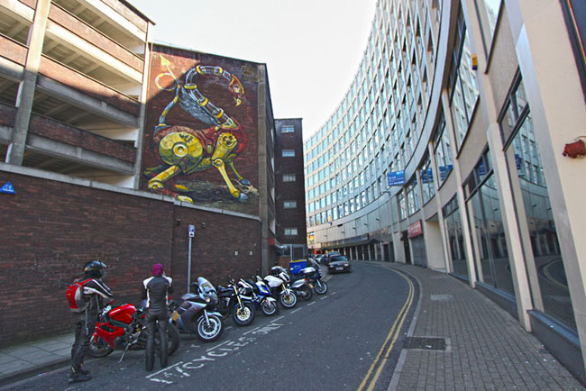 More street art on Nelson Street office buildings in Bristol, England