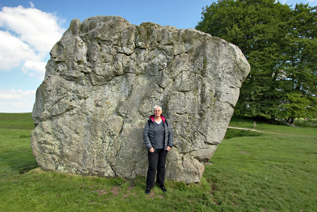 Barbara Weibel, next to one of the larger standing stones at Avebury