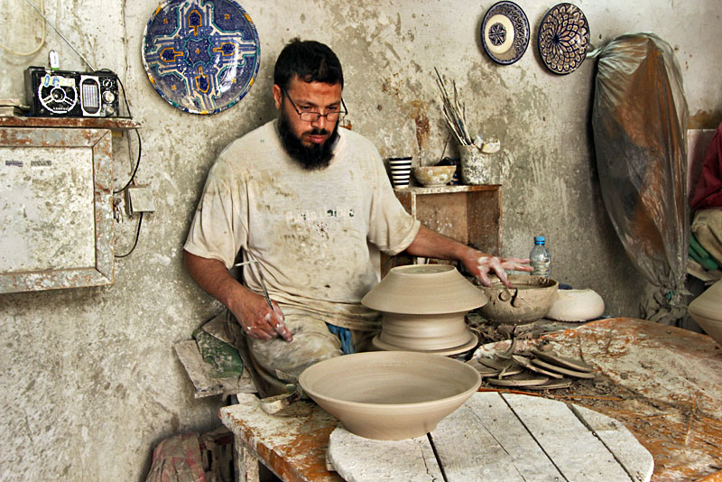 Artisan Throws Pottery by Hand in a Ceramic Factory in Fez, Morocco