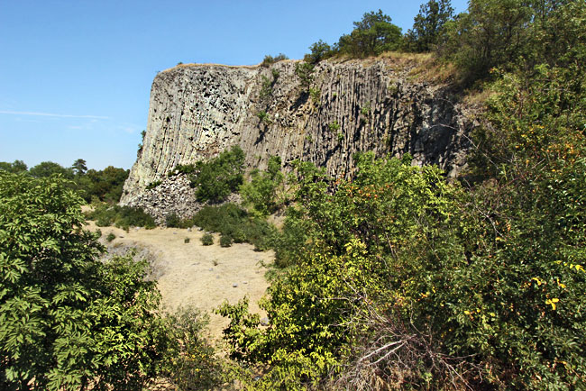 Crystallized columns of an ancient basalt volcano cone at Hegyestu Geological-Interpretive Site in the Kali Basin
