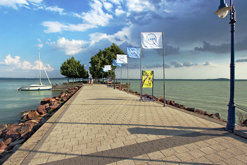 Pier Stretches Out Into the Eye-popping Multi-colored Waters of Lake Balaton in Revfulop, Hungary
