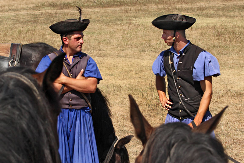 Traditional Herdsmen of Hungary take a break from rounding up livestock at Hortobagy National Park, a protected area of grasslands