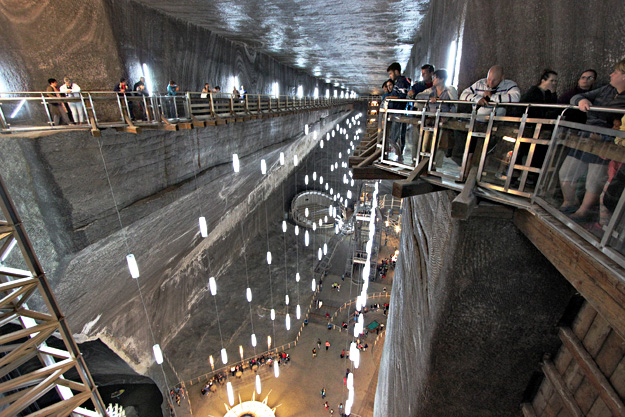 Wooden deck built into a ledge cut into sheer salt walls provides a bird's eye view of the Rudolf Mine