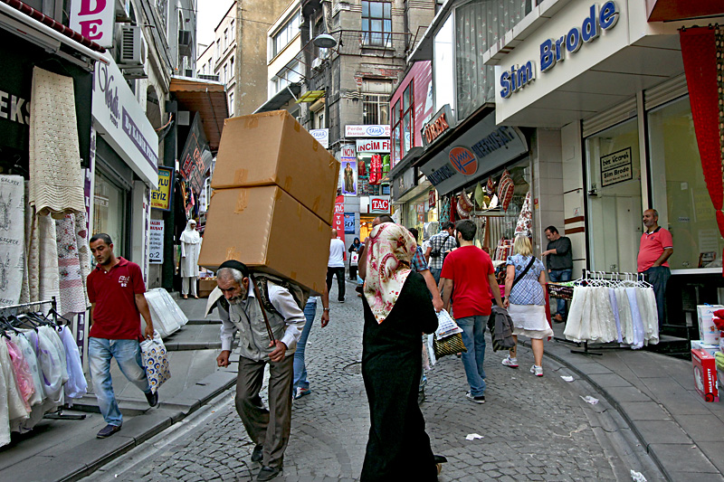 Turkish Man Carries Cargo on His Back Through the Streets of Istanbul