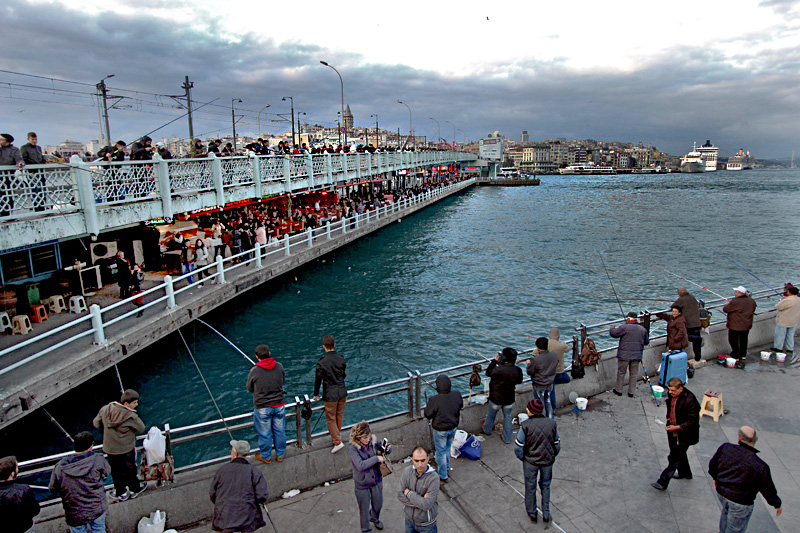 Lower Level of Galata Bridge in Istanbul is Lined with Restaurants While Above, Fishermen Cast Their Lines