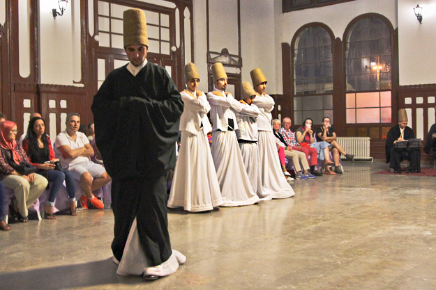 Arms crossed over the chests of the dervishes symbolize the number one, testifying to God's unity