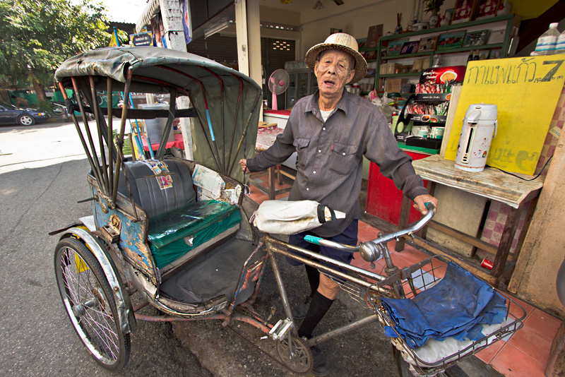 Trishaw Driver Poses for Photo at a Local Produce Market in Chiang Mai, Thailand