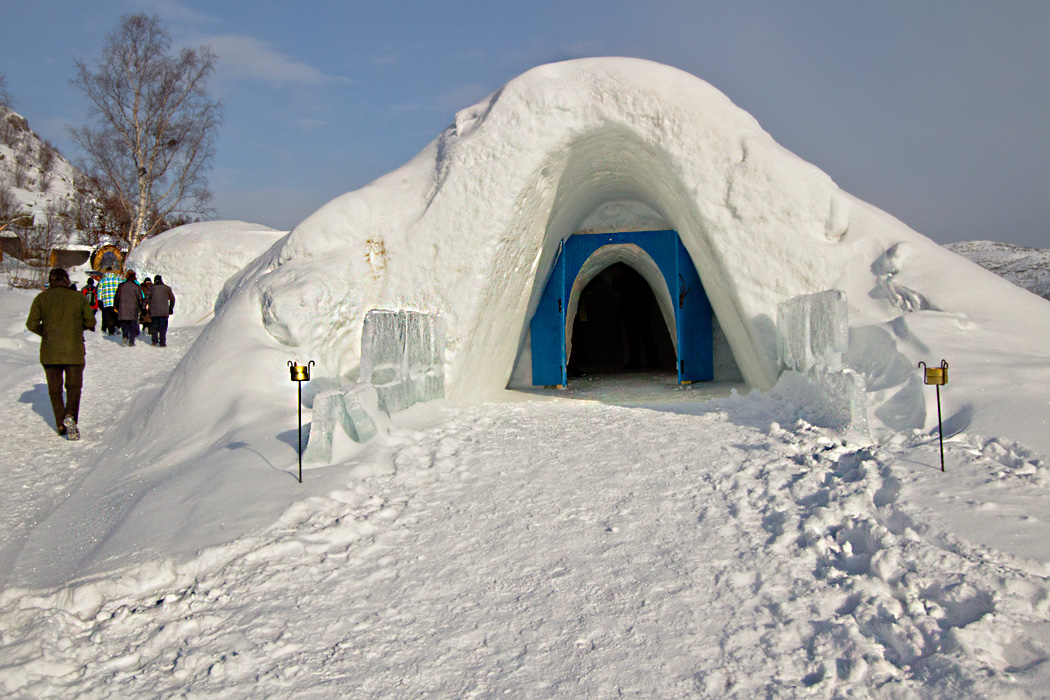 The Snow Hotel in Kirkenes Norway features ice beds, sculptures, and the largest ice bar in the country