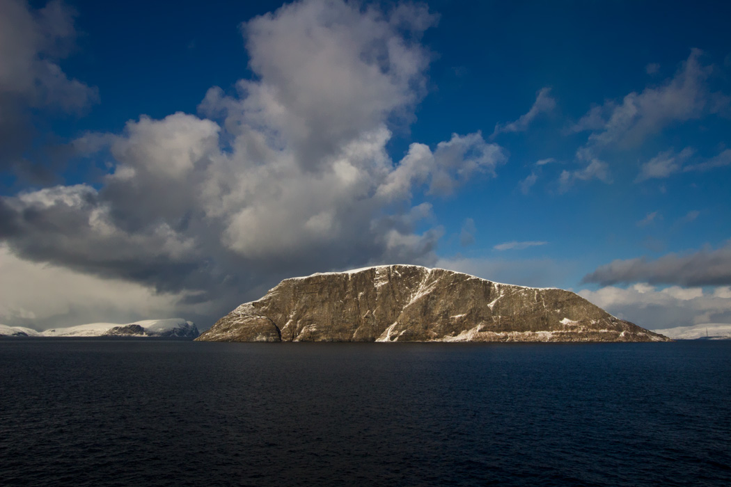 Huge rock wells up from the Arctic depths on the Hurtigruten voyage near Hammerfest Norway