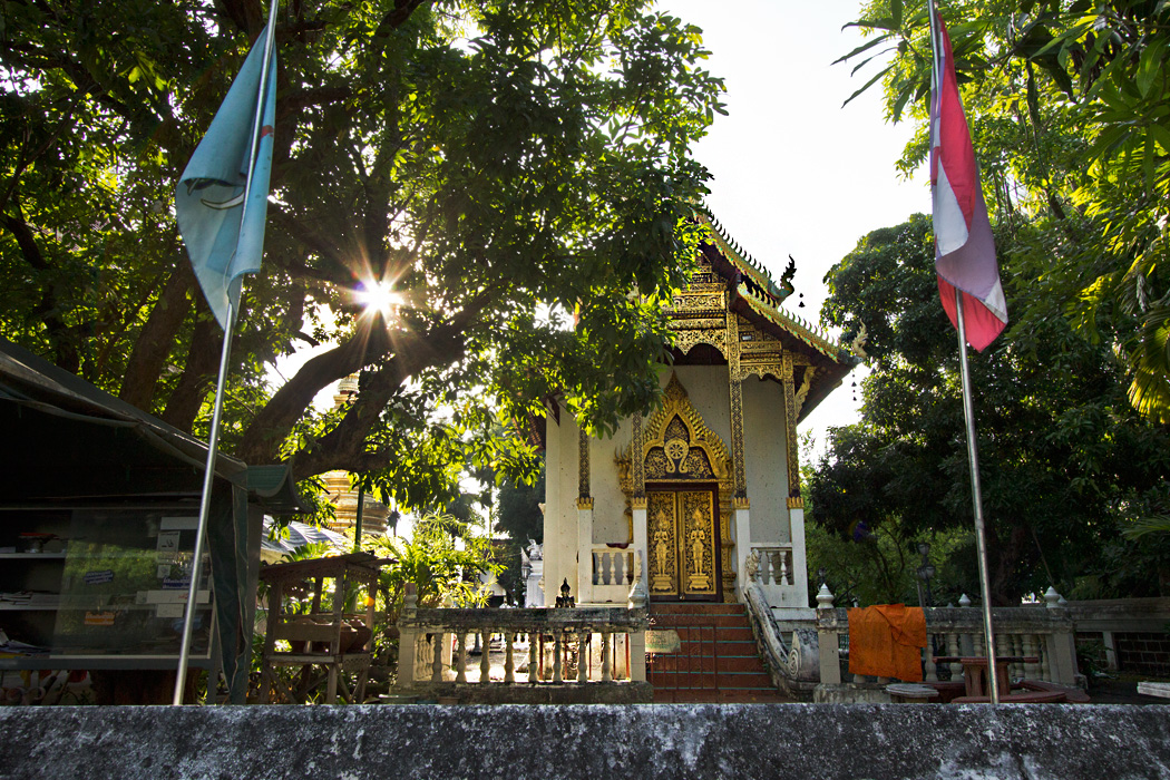 Sun sets over small prayer hall at lesser-known Wat Nantaram in Chiang Mai, Thailand