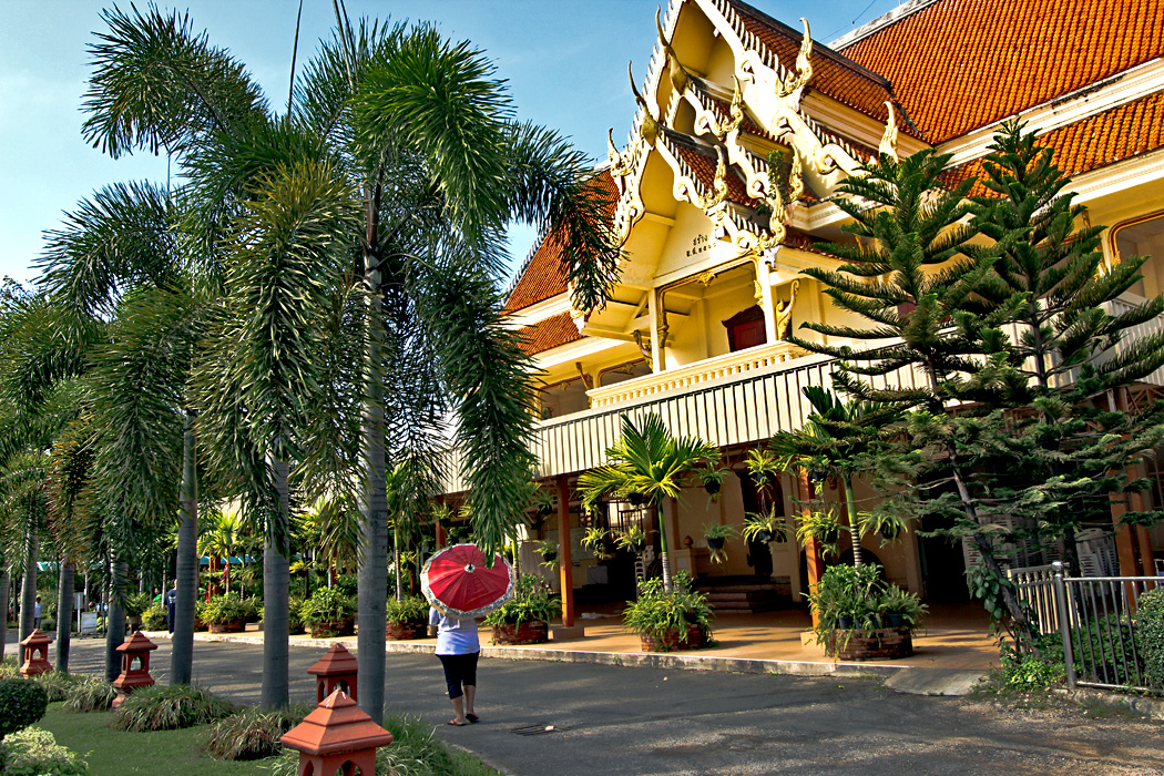 Strolling the exquisitely landscaped grounds of Wat Phra Singh in Chiang Mai, Thailand