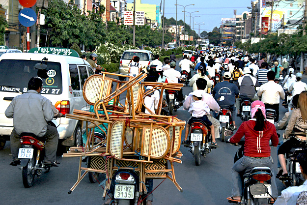 Intimidating traffic in Saigon was just one of the aspects of the culture that rattled me. And yes, that's a set of six dining room chairs being carried on a motorbike.