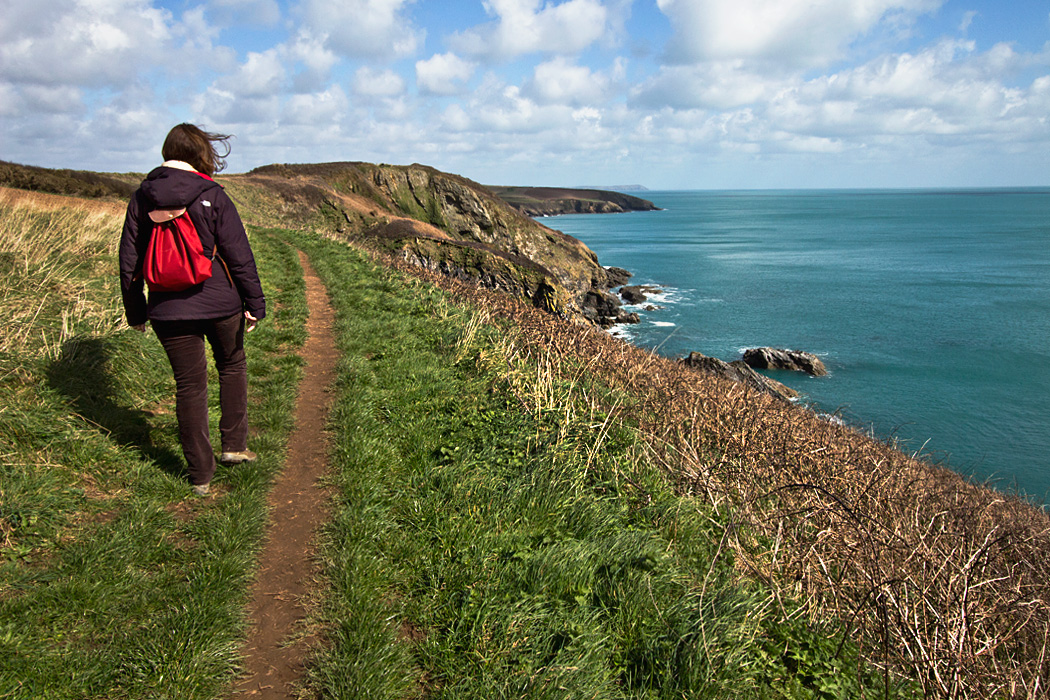 Hiking the South West Coast Path around Saint Anthony Head in Cornwall, England