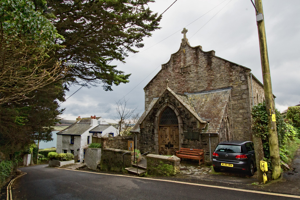 Pretty churches and cottages line the hilly streets of Saint Mawes in Cornwall, England