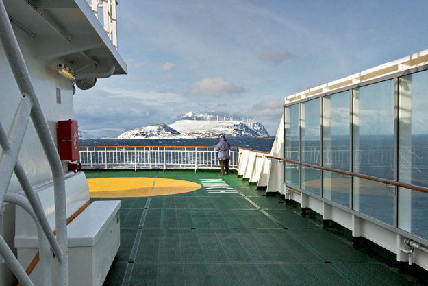 Departing Havoysund provides a view of windmills atop the mountain, which provide power for this remote Norwegian town