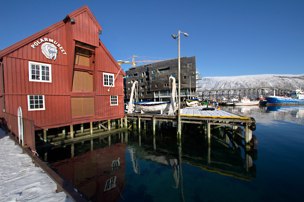 Polar Museum in Tromso Norway Reflects Into Still Waters of a Finger of the Norwegian Sea