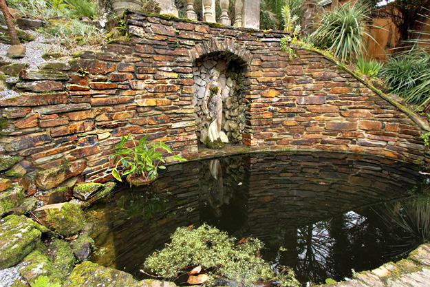 One of the Italianate-inspired statues and ponds at Lamorran House Gardens