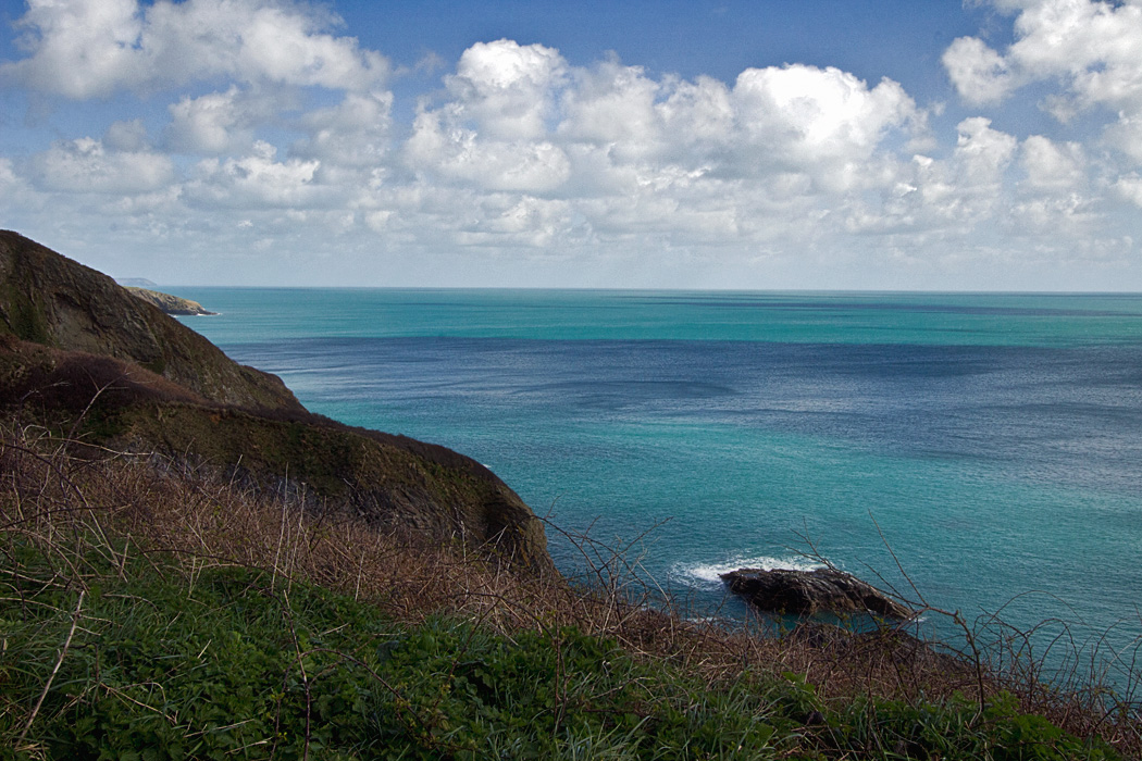 The wild coastline on the South West Coast Path around St. Anthony Head in Cornwall, England