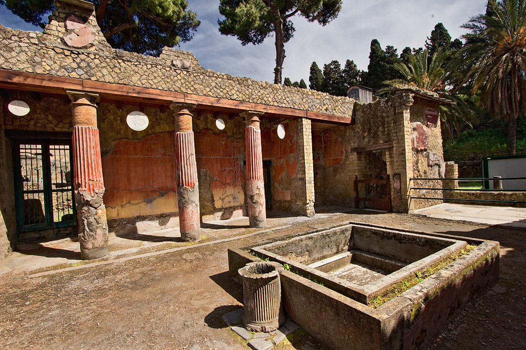 Discs hanging between pillars ward off evil at House of the Relief of Telephus in Herculaneum