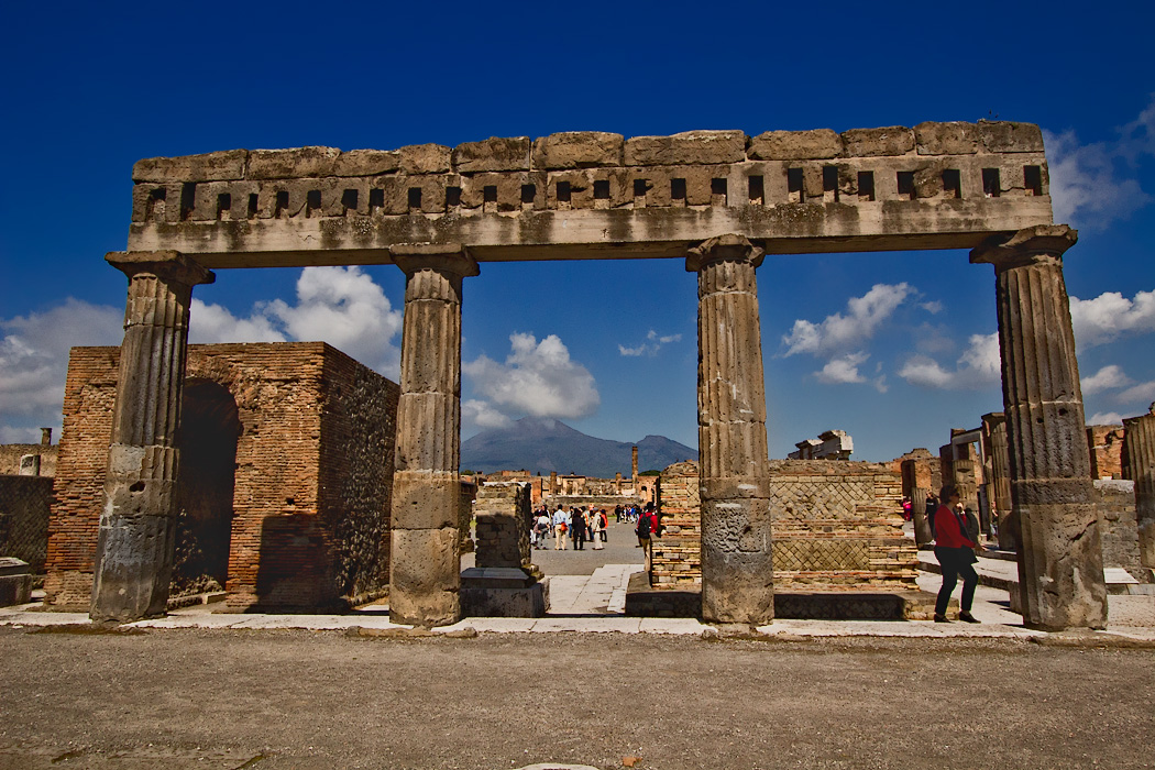 Capped columns mark one end of the Forum at the Roman ruins in Pompeii, Italy, which was destroyed by the eruption of Mount Vesuvius in 79 AD