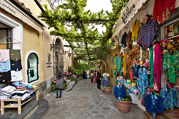 Overhead arbor provides shade for a shopping street in Positano, Italy