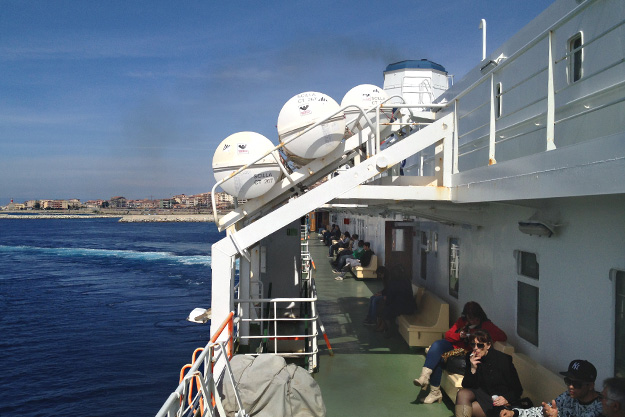 Once the train cars are loaded, the ferry begins the short trip to Messina, Sicily