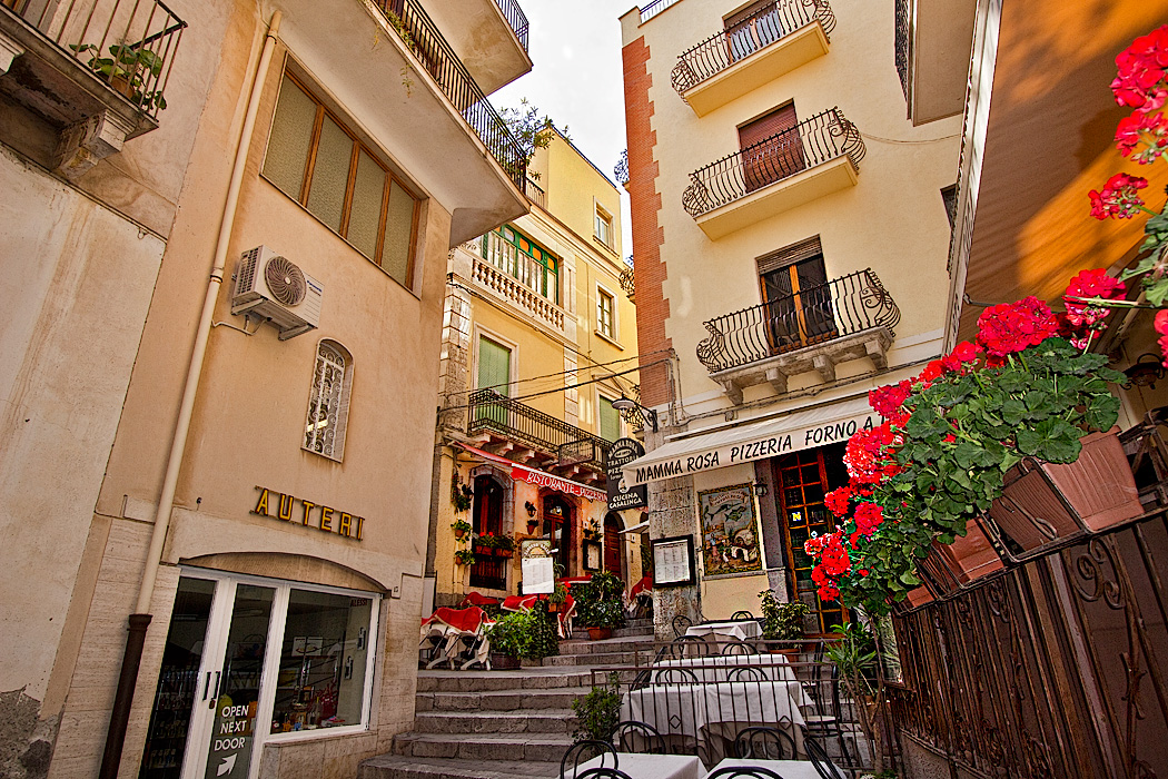 Stairways climb past exquisite shops and residences in Taormina, Sicily, Italy