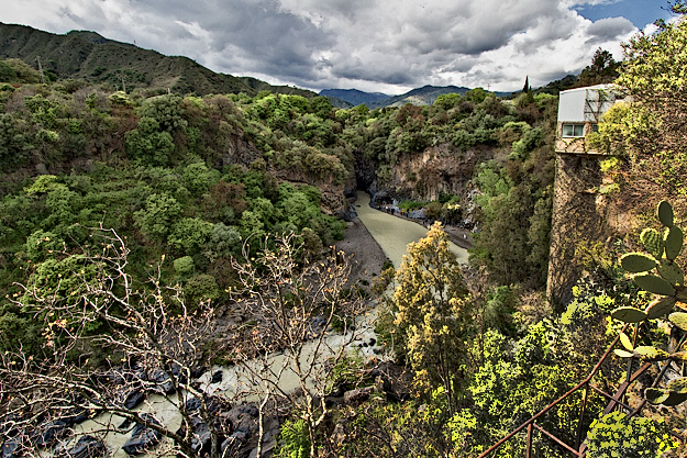 Alcantara Gorge lies between the cities of Taormina and Catania on the east coast of Sicily, Italy