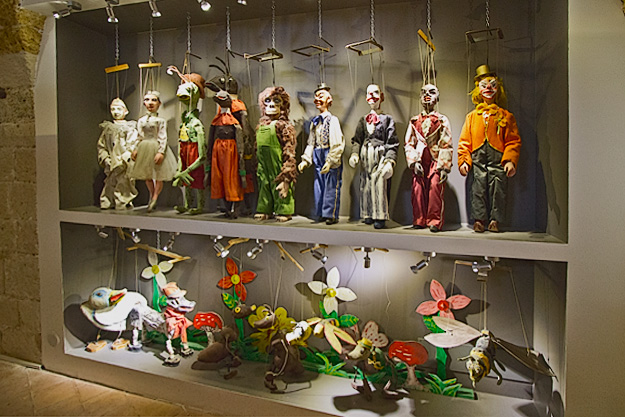Smaller marionette puppets on display at the Puppet Museum