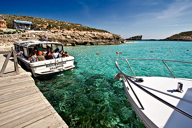 The small dock on Comino sees a stead stream of boat traiffic throughout the day