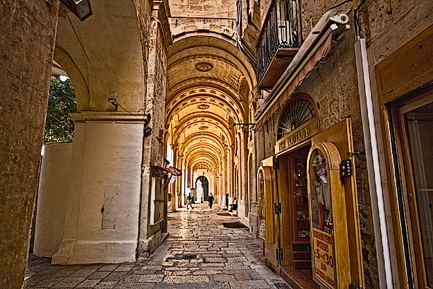 Medieval covered walkway leading to the public library in Valletta, Malta is a study in the history of Malta