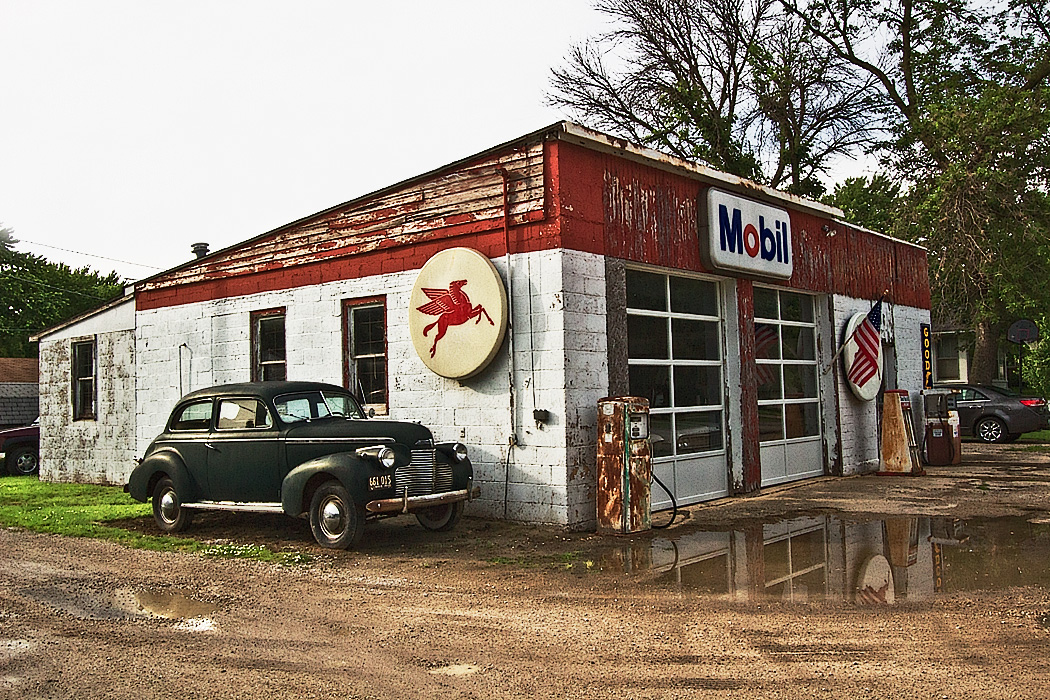 Old Mobile Gas Station on U.S. Route 66 in Odell, Illinois, complete with rusting pumps and old car