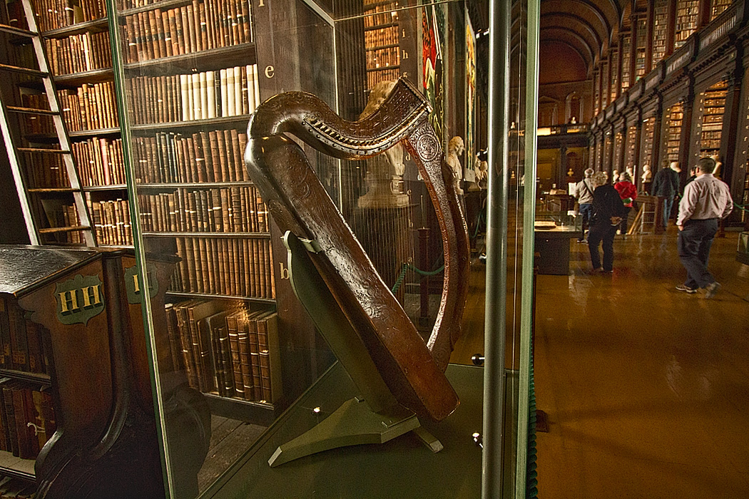 Bria Boru Harp, sacred symbol of Ireland, stands on exhibit in the Long Room Library on the campus of Trinity College in Dublin