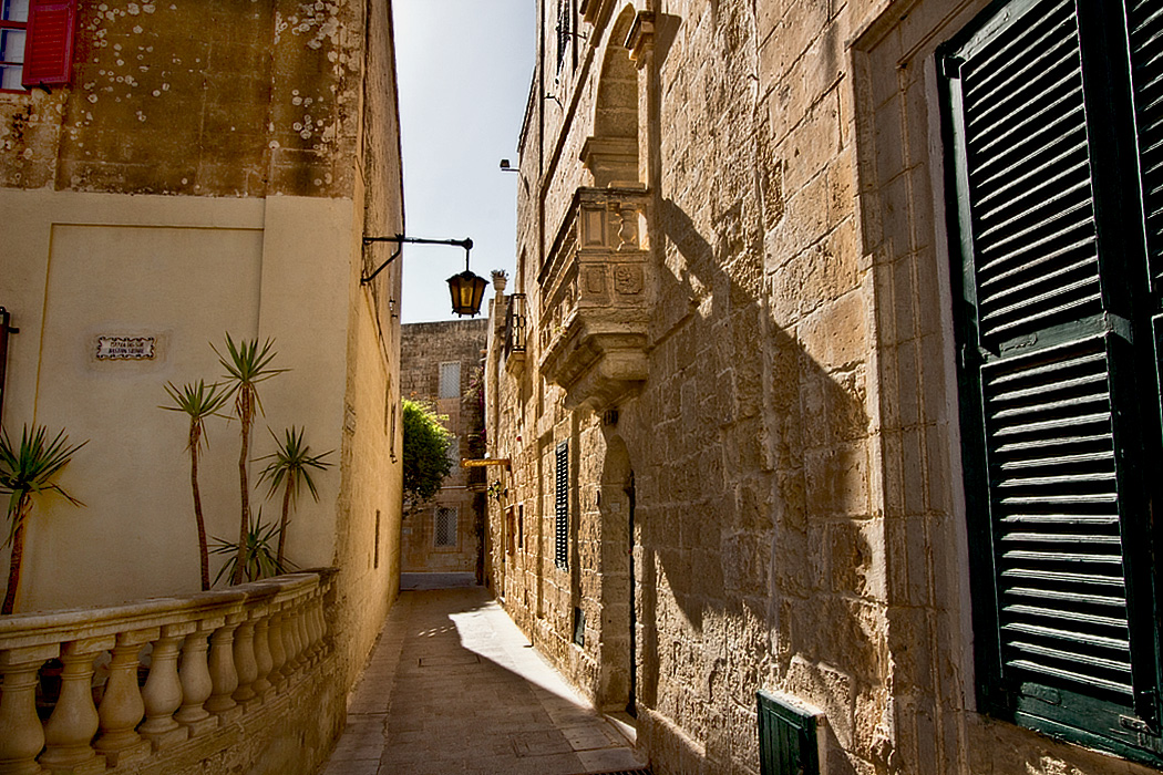Typical walkway between the ancient stone buildings in Mdina, the original capital of Malta