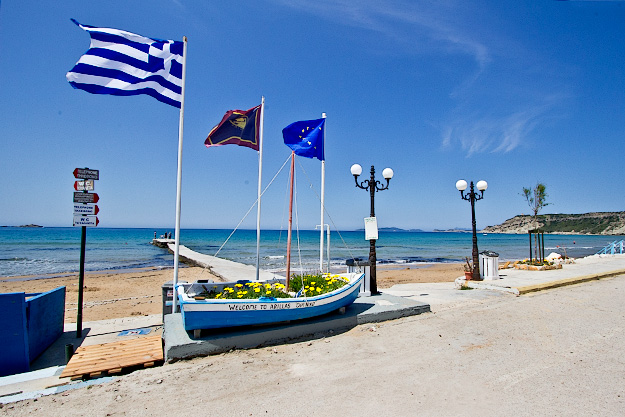 The seafront, beach, and pier in Arillas, Corfu