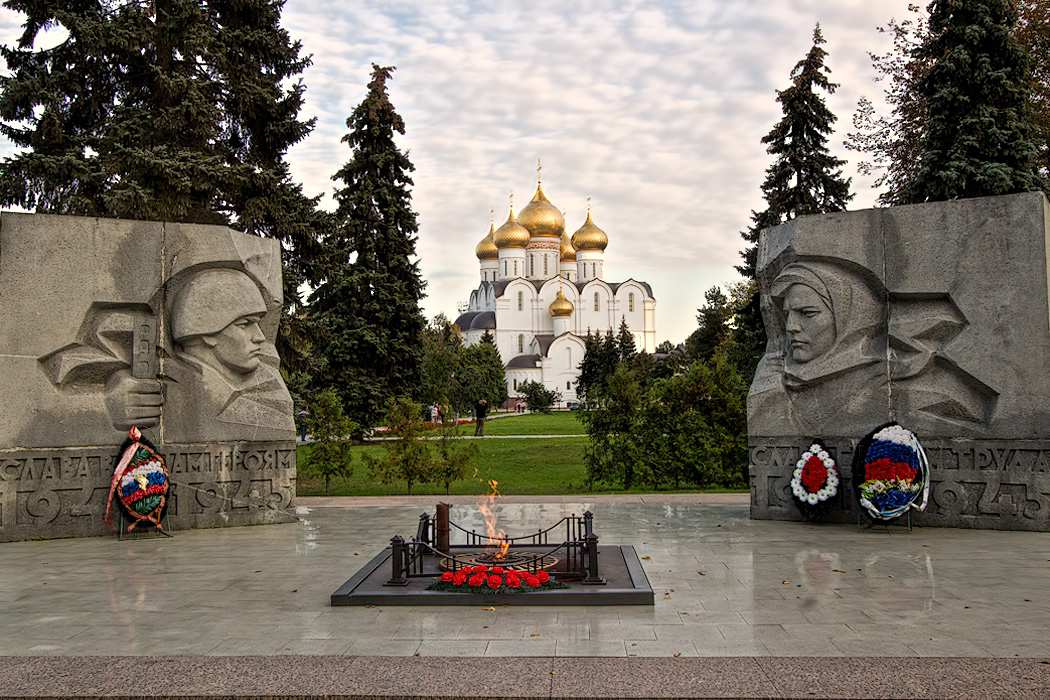 WWII Memorial and eternal flame frame the Church of the Assumption in Yaroslavl, Russia