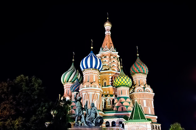 Domes of St. Basil's Cathedral in Moscow's Red Square are brightly illuminated at night