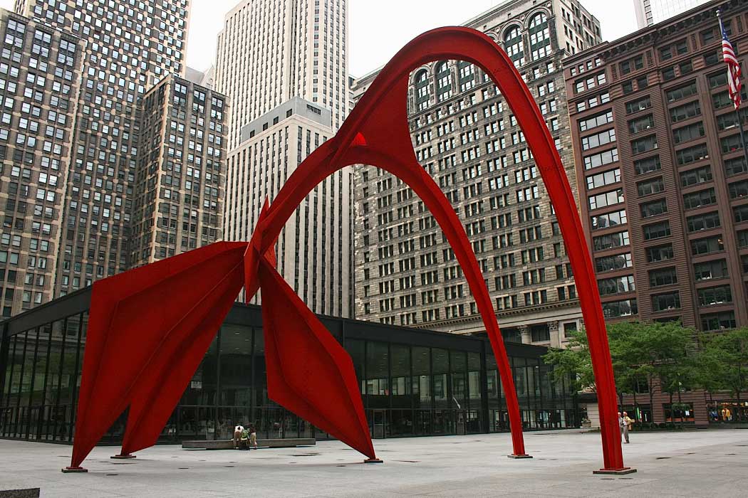 Giant Flamingo sculpture stands in front of the Federal Building in downtown Chicago