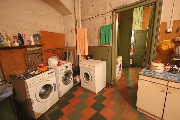 Washing machines for individual apartments stand in the common areas